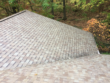 Shingle roof safely cleaned with low pressure to remove algae.